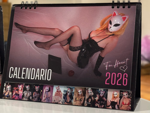 Calendar with a model in lingerie and a Japanese Fox mask on a pinkish background, featuring the brand 'FoxHeart'.